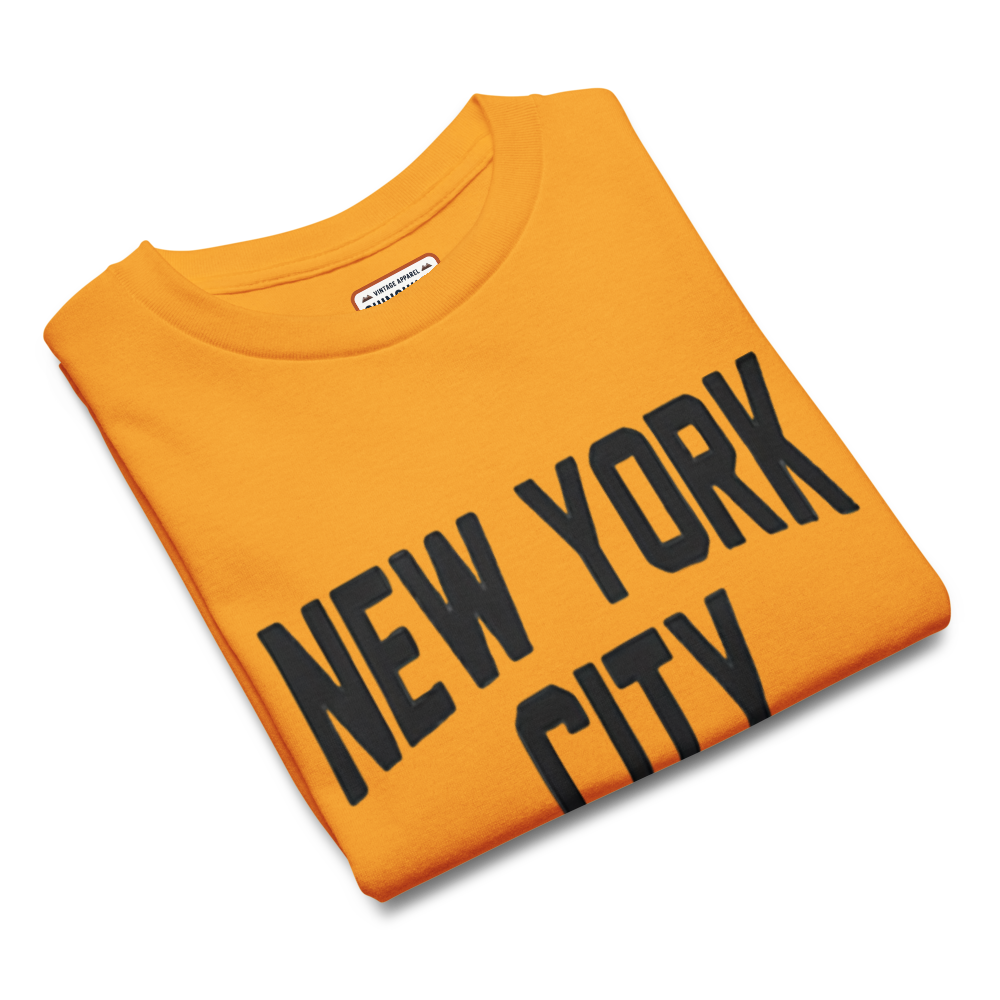 Folded orange sweatshirt with 'New York City' text on a white background